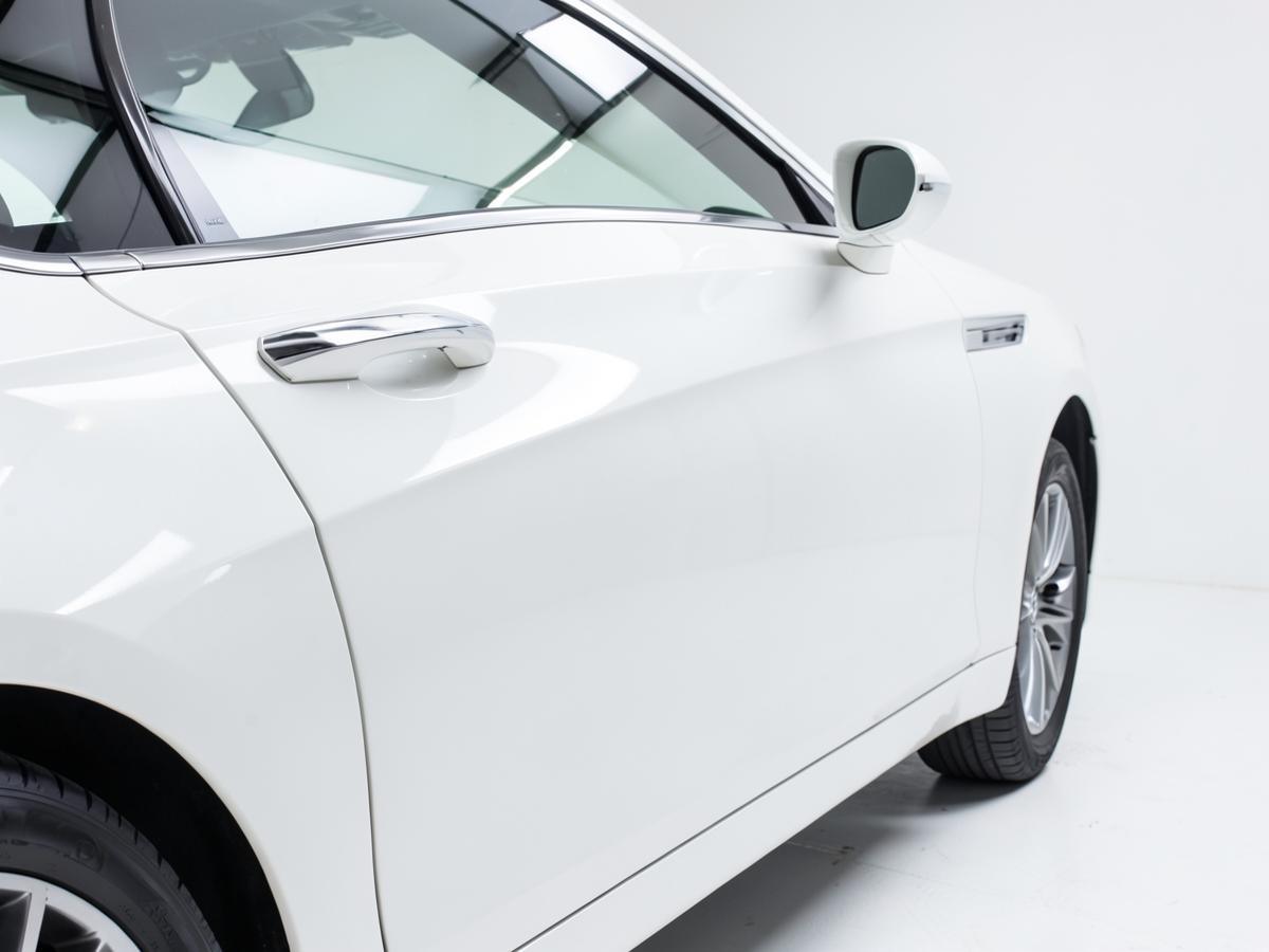 Glossy white car panel after paint correction and PPF